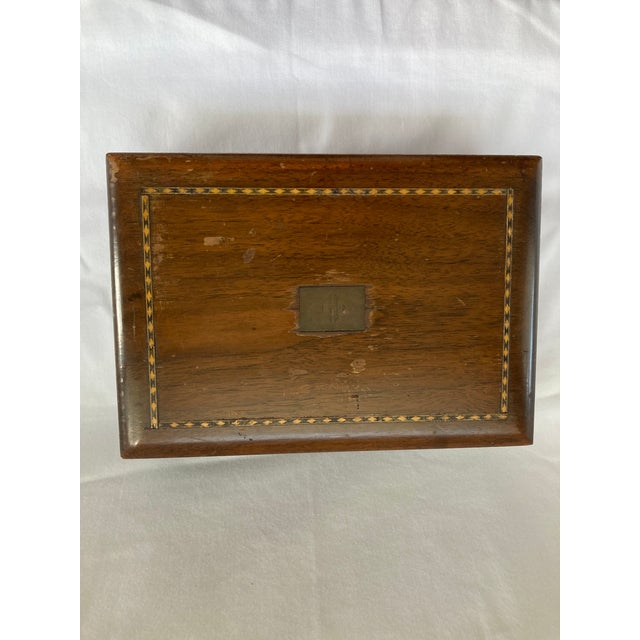 Antique inlay wooden box with centered “H” monogram, and with the interior lined with white glass. Sold by the B. Altman &...