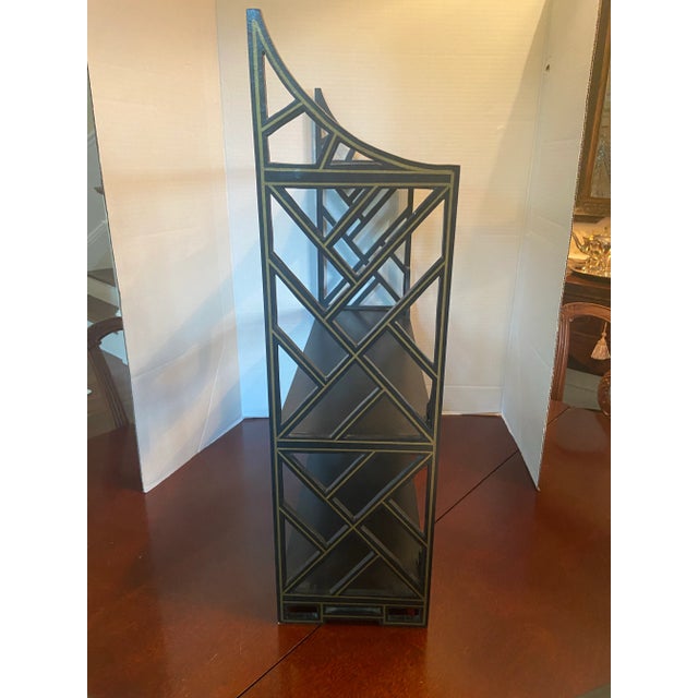 Vintage black fretwork tabletop shelf, trimmed in gold. Perfect for displaying a collection of small, valued objects