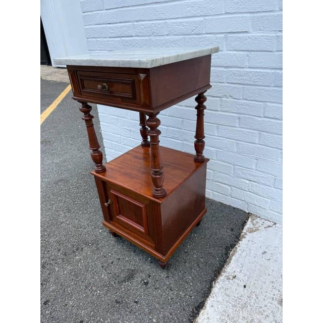 Antique French style Marble top 2 Tier Nightstand on casters Very nice craftsmanship with solid panels on all four sides....