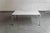 Very sleek carrera marble coffee table, designed by Chinese-Dutch designer Kho Liang Ie in the 1950’s and produced by...