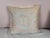 This elegant pillow showcases exquisite Fortuny textile craftsmanship. The front features a soft blush-toned background...