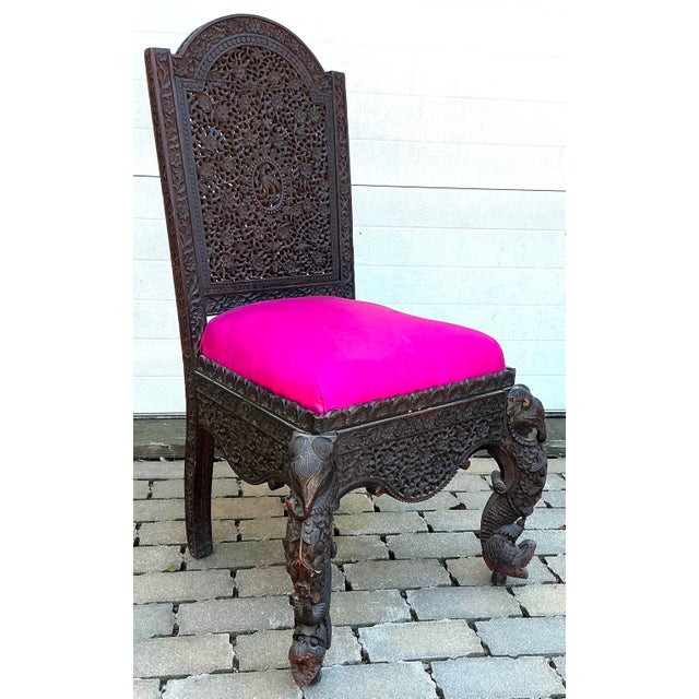 Beautiful pierced carved chair. Phenix bird carved on back splash, elephants, birds and dragons on front legs. Circa 1880.