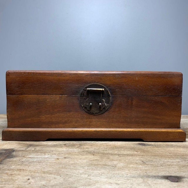 This lovely vintage rectangular storage box is handcrafted from warm pear wood. The lid features intricate mother-of-pearl...