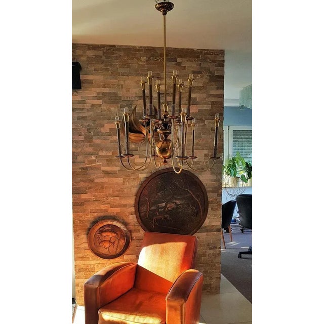 Mid-Century from brass with 12 light bulbs, Italy in the 1950s. European Plug (up to 250V).The wiring of this item may be...