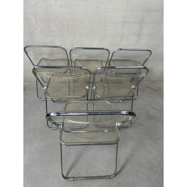 A set of 6 original Plia folding chairs. The Plia folding chair was designed by Giancarlo Piretti for the manufacturer...