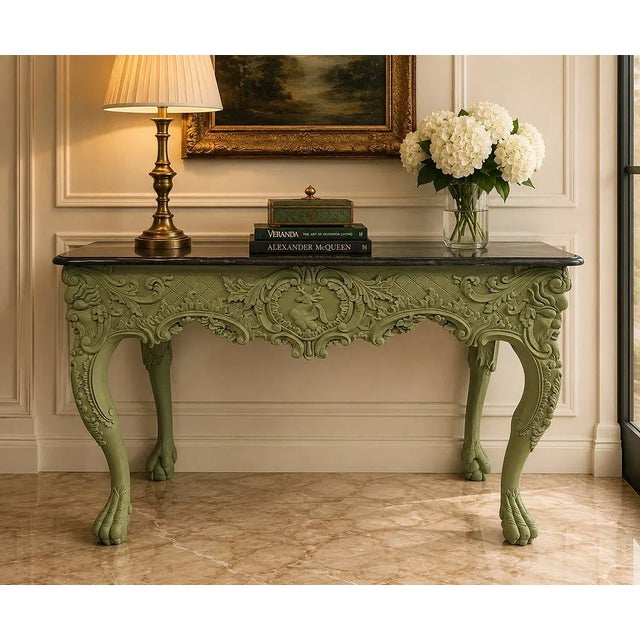 Hand-carved decorative console table featuring an olive green painted finish with exceptional relief carving throughout....