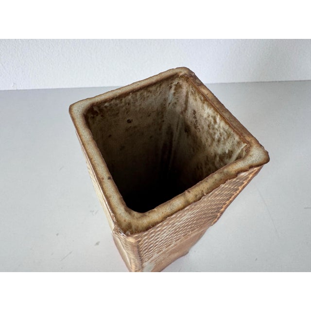 Beautifully handcrafted, this vintage Steven’s studio pottery vase embodies the organic sensibility and tactile artistry...