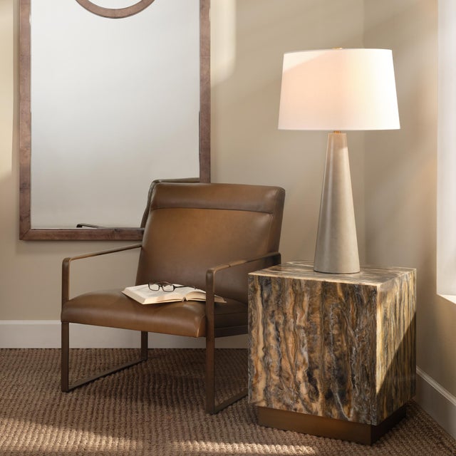 Hemingway Accent Chair, Truffle Leather The strong metal frame of this accent chair has been color-matched with the top-...