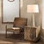 Hemingway Accent Chair, Truffle Leather The strong metal frame of this accent chair has been color-matched with the top-...