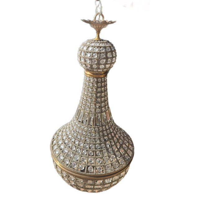 A breathtaking monumental chandelier that captures the glamour and theatrical elegance of the Hollywood Regency era. This...