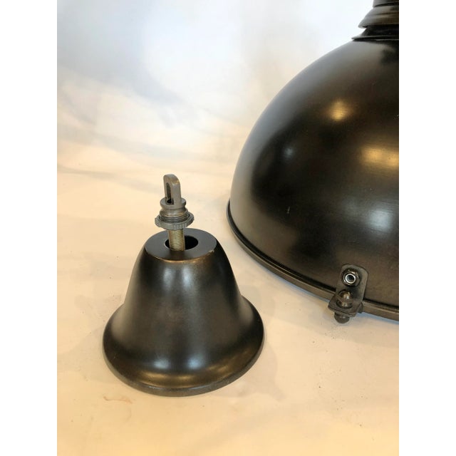 This classic industrial inspired pendant in minimally finished metal gives any interior an edgy urban vibe. This iconic...