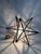 An exceptional and iconic early 20th-century "Moravian Star" pendant light, hand-crafted during the interwar period (circa...