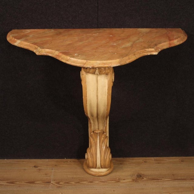 Italian console from the mid-twentieth century. Furniture of beautiful line and pleasant decor in carved, lacquered and...