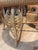 Custom made, rattan barrel back dining set. Featuring peacock scrolls and beading details on both table and chairs. The...