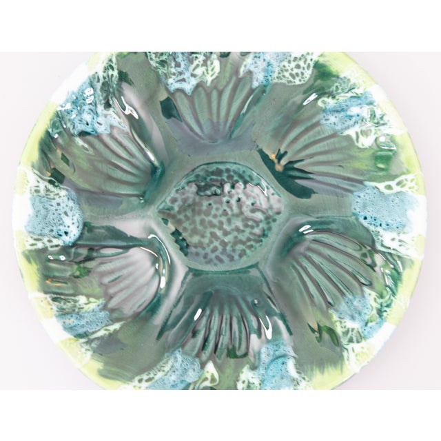 A gorgeous vintage French Vallauris oyster plate in lovely shades of green and turquoise from the South of France, circa...