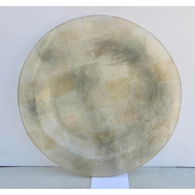 Translucent lucite tray with inset patchwork accent colors and silver metal fibers. A patchwork of clear and amber color...