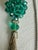 Long 1980s pendant necklace featuring a multifaceted teal-green crystal cluster bead, rhinestone-accented rondelle spacer,...