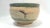 A wonderful hand thrown studio pottery ceramic decorative bowl with a muted matte drip style glaze in a matte finish and a...