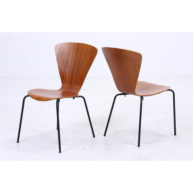 Set of 2 Teak Chairs in Danish Design Set FEATURES * High-quality workmanship * Material: Teak & steel tubing * Timeless...