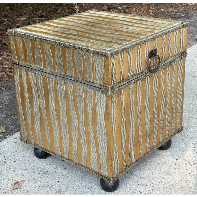 Hollywood glam hinged footed trunk perfect as a drinks or side table. It’s lined inside with a celadon textured Chinese...