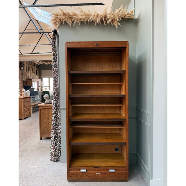 An exceptional piece: a large roll-top filing cabinet from the french brand lacour, produced in the 1950s-1960s, made of...