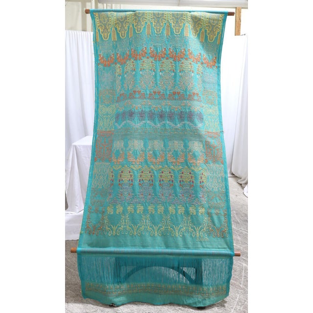 A tapestry by textile artist, New Jersey-Nicaraguan Armando Sosa. The tapestry is hand woven cotton and silk and applies...