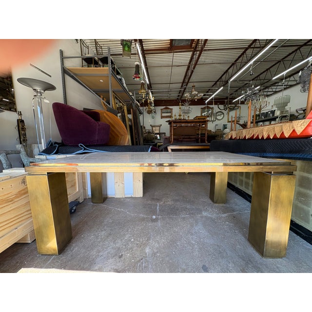 French Modern Brass And Travertine Dining Table. Offered is a stunning French patinated brass Parsons style dining table...