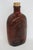 This gorgeous Log Cabin glass syrup bottle features a lovely amber color and various embossed designs around the piece. It...