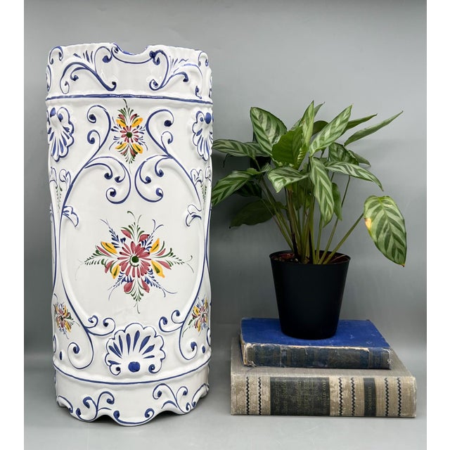 Stunning, vintage hand-painted ceramic umbrella stand from Portugal featuring colorful floral sprays surrounded by cobalt...