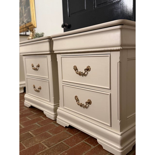 A sophisticated pair of generously proportioned three-drawer nightstands, beautifully refinished in Sherwin-Williams...
