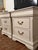 A sophisticated pair of generously proportioned three-drawer nightstands, beautifully refinished in Sherwin-Williams...