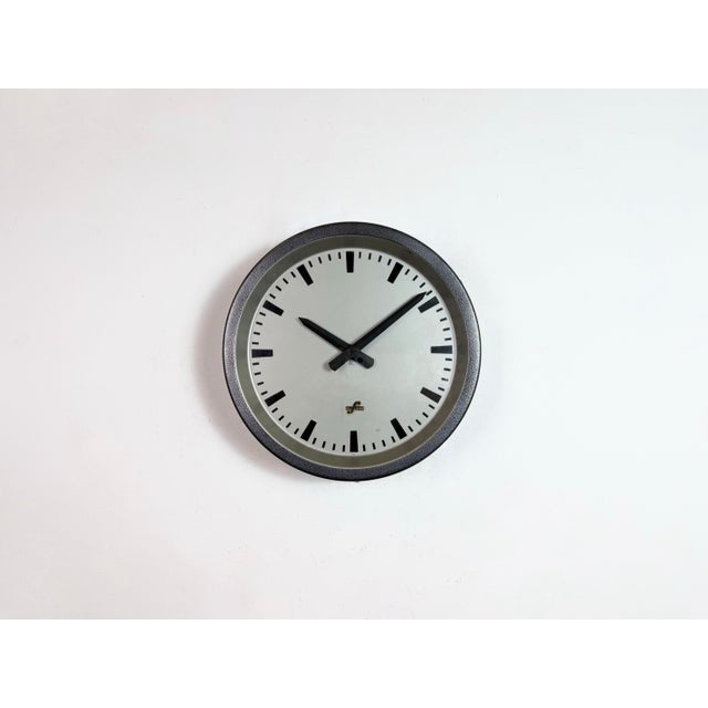 This wall clock was produced by Elfema (Electro-Mechanics Mittweida) in East Germany during the 1960s. The piece features...