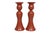 A pair of Fitz and Floyd ceramic candlestick holders in cinnabar red, made in Japan. Tulip shaped, with curvaceous...