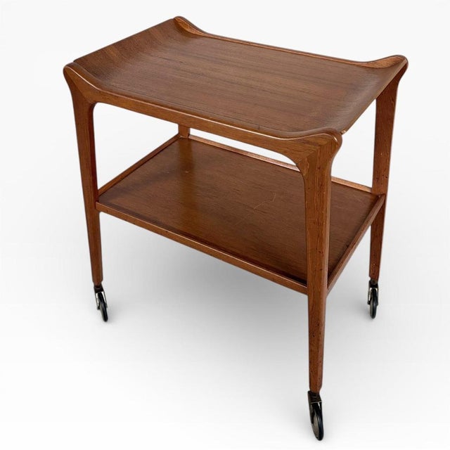 A stunning and original mid-century modern example of ‘the glyder’ bar cart, produced by paragon furniture (e.d. & s.,...
