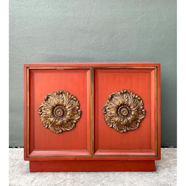 Crafted by Lane, this vintage red cabinet offers a striking example of mid-20th-century design with its bold use of color...