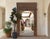The Heritage Portal" is a monumental work of architectural salvage, transformed into a breathtaking floor mirror. Standing...