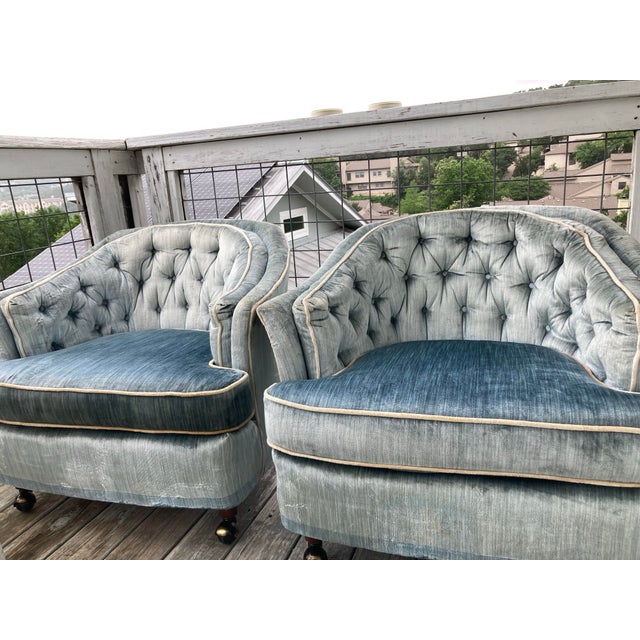 Two vintage, upholstered Highland House of Hickory lounge club chairs. Each chair has four casters and original tags....