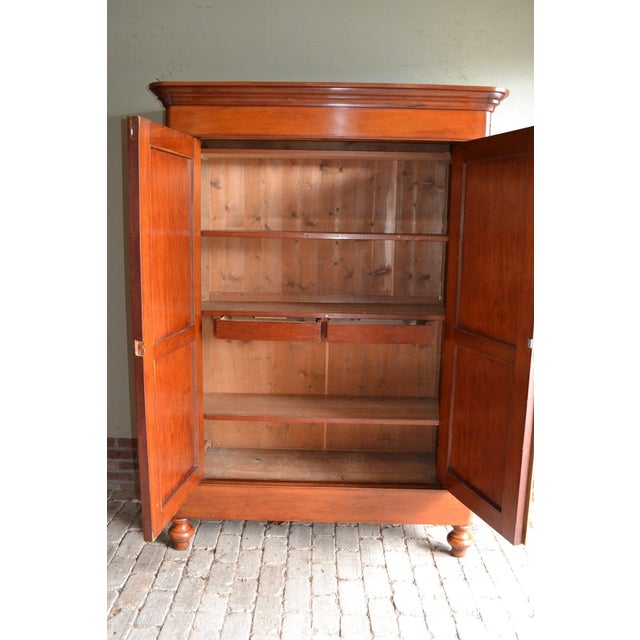 19th-century Dutch mahogany Biedermeier maid's cabinet. The height is 195 cm. The width is 139 cm. The depth is 48 cm....