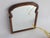 An antique arched wooden mirror with a nice scalloped frame. The mirror dates back to the 19th century and these types of...