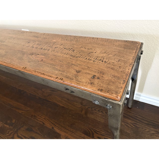 table is 86x37x31h Bench 6'x1'x19" A striking Arhaus Ironwood dining table accompanied by its matching bench. This...