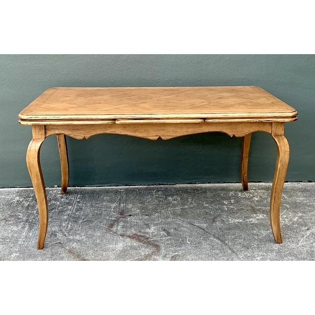 This exquisite bench-made dining table by Bausman & Company is a superb example of traditional French Provincial design....