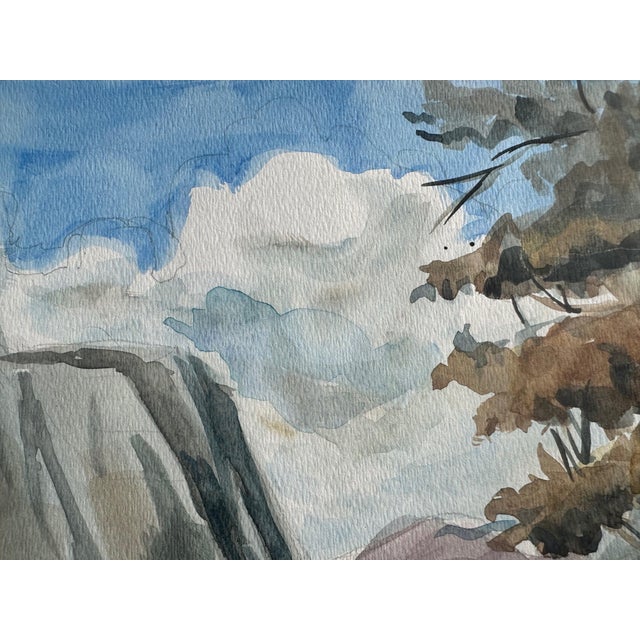 A calm and serene watercolor landscape with a lake and hills in the distance. I love the cotton-like clouds against the...