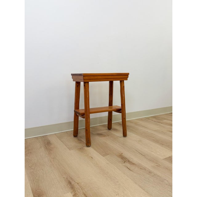 This charming handmade rustic pine side table dated from the 1930s is a warm and genuinely characterful artisan furniture...