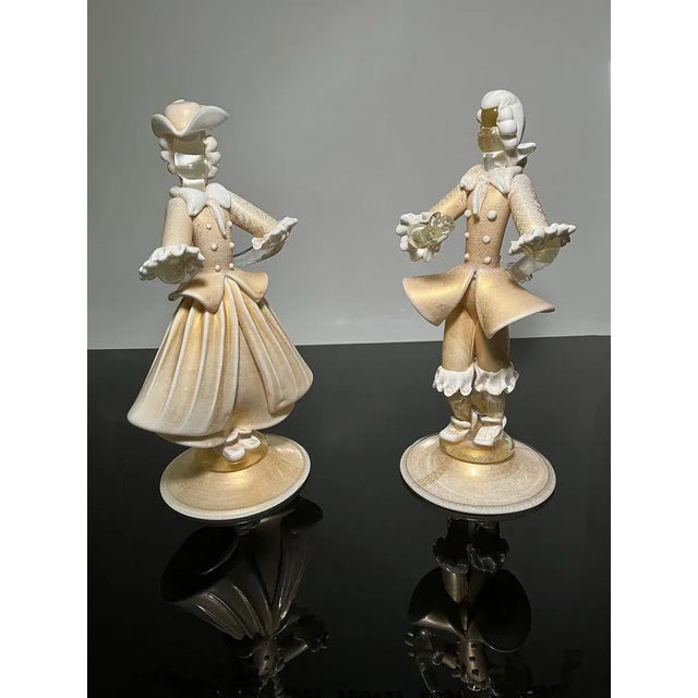 Stunning Figurines of a lady and a gentleman in Murano Glass. Gold avventurine and white lattimo glass. Very fine Murano...