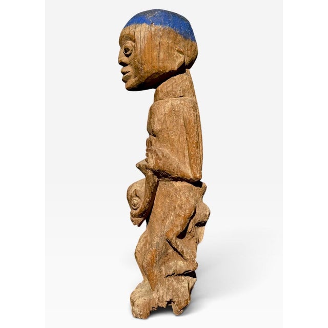 Antique Nigerian (Yoruba) veranda post fragment depicting a warrior mounted on his horse. The subject holds the horse's...