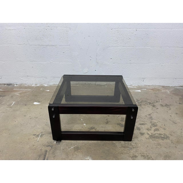 Rosewood and smoked glass top coffee or side table by Percival Later. Brazil, 1970s; maintains original label.