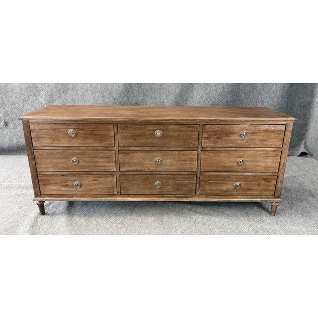 This Restoration Hardware Maison Collection 9-drawer dresser showcases a refined late 18th-century French-inspired design...