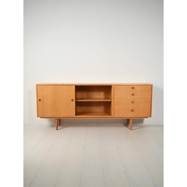 Scandinavian oak sideboard by Børge Mogensen for Karl Andersson & Söner. Two connected modules with sliding doors and...
