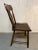 Early wooden plank bottom chair with lyre style back design and all wooden construction.