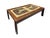 A Danish tile top coffee table attributed to Lysgaard Møbler circa 1960. Made of rosewood, inset with two identical,...